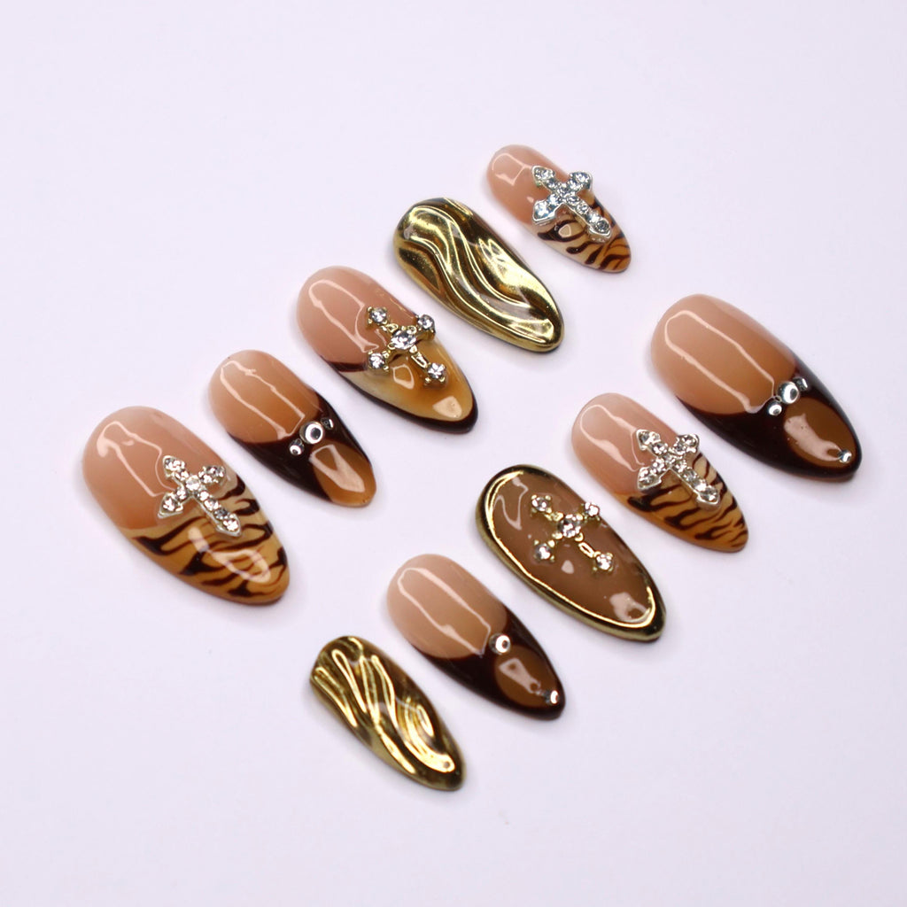 Fierce Fall Vibes, French Tips Meet Wild Tiger Print with 3D Gel Chrome Gold Cross and Dazzling Gems - Perfect for Your Autumn Style