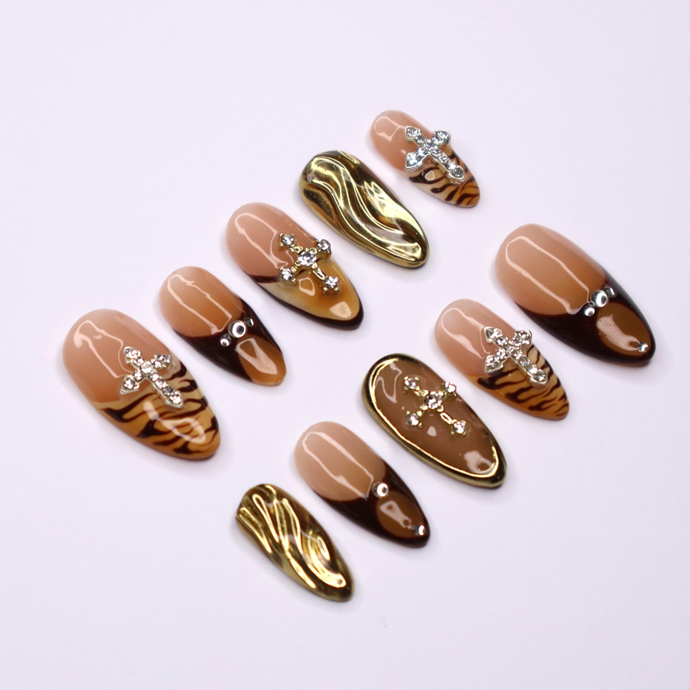 Fierce Fall Vibes, French Tips Meet Wild Tiger Print with 3D Gel Chrome Gold Cross and Dazzling Gems - Perfect for Your Autumn Style