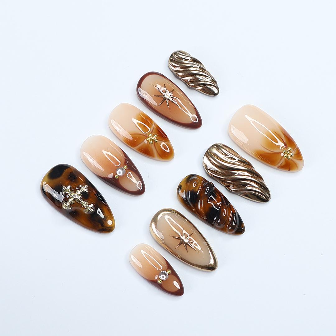 Fall Press On Nails with Tortoise Shell and Gold 3D Accents, Medium Almond Brown and Nude Nails with Starburst and Textured Chrome Design