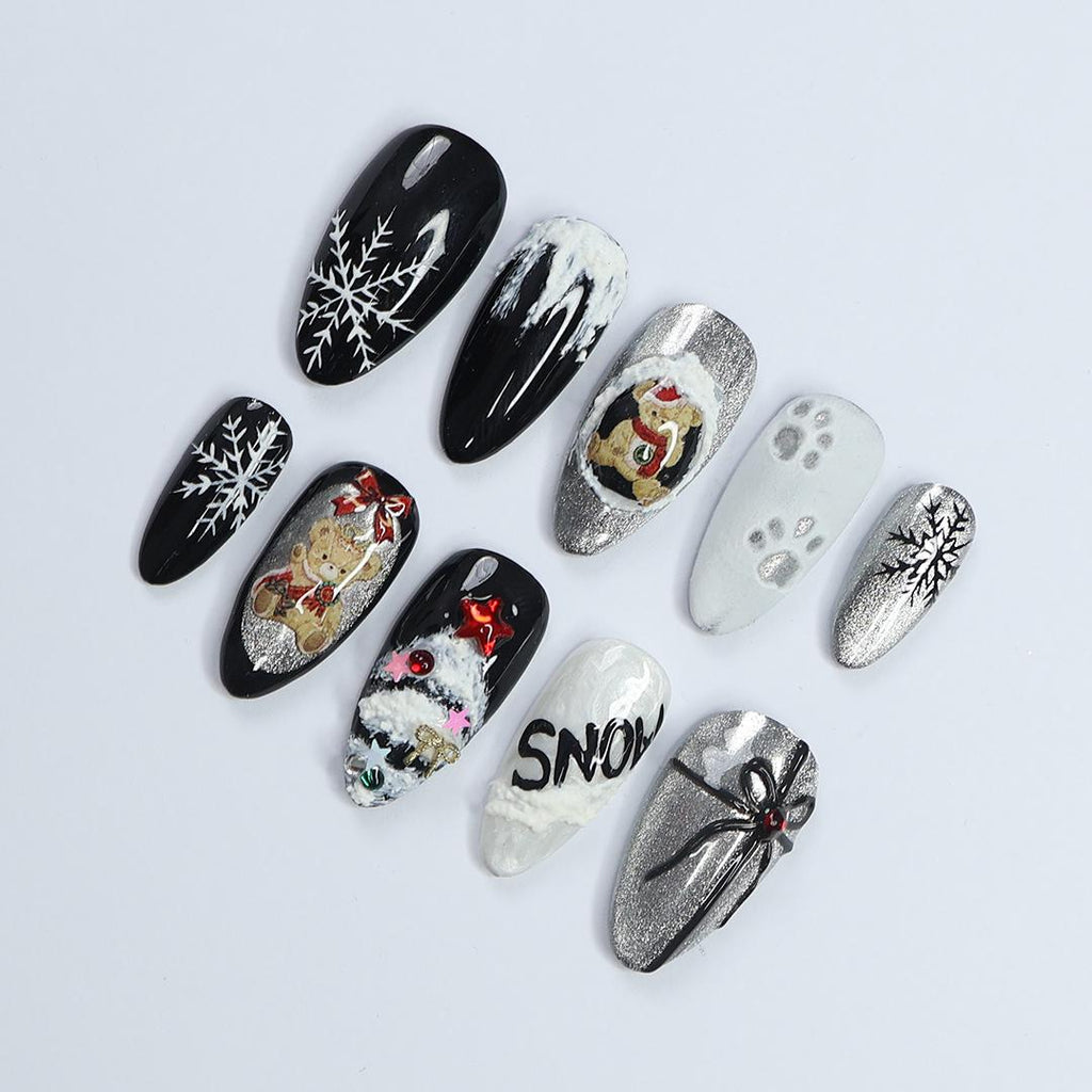 Elevate Your Holiday Style with Medium Almond Press-On Nails: Sleek Black Design Adorned with White Snowflakes - Perfect Christmas Gift