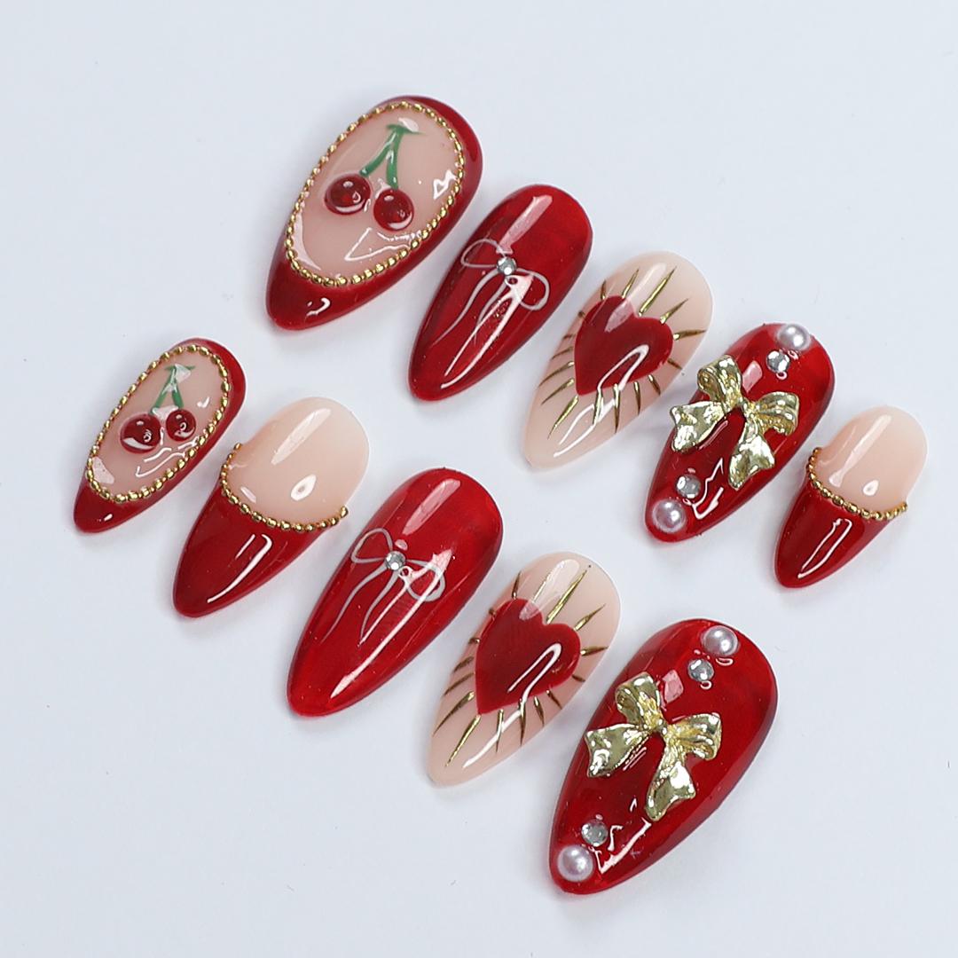 Chic Dark Red Press-On Nails: Adorned with Gold Bows, Charming Cherries & Sparkling Gems - Perfect Holiday Glam or Thoughtful Gift for Her