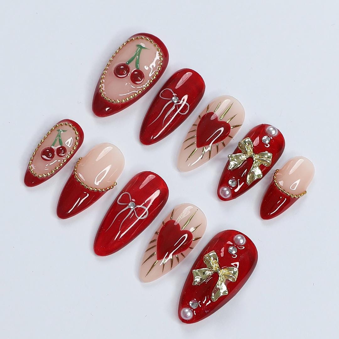 Chic Dark Red Press-On Nails: Adorned with Gold Bows, Charming Cherries & Sparkling Gems - Perfect Holiday Glam or Thoughtful Gift for Her