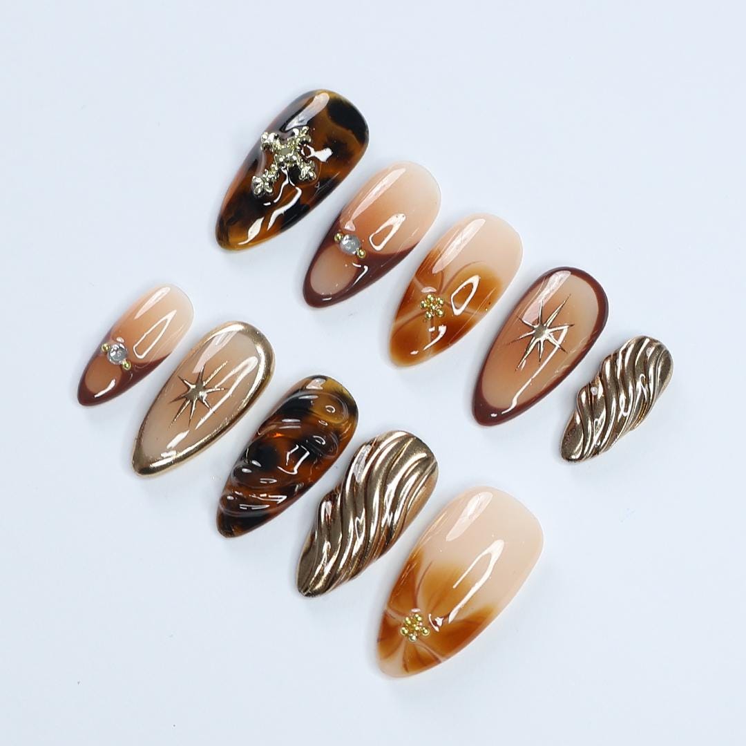 Fall Press On Nails with Tortoise Shell and Gold 3D Accents, Medium Almond Brown and Nude Nails with Starburst and Textured Chrome Design