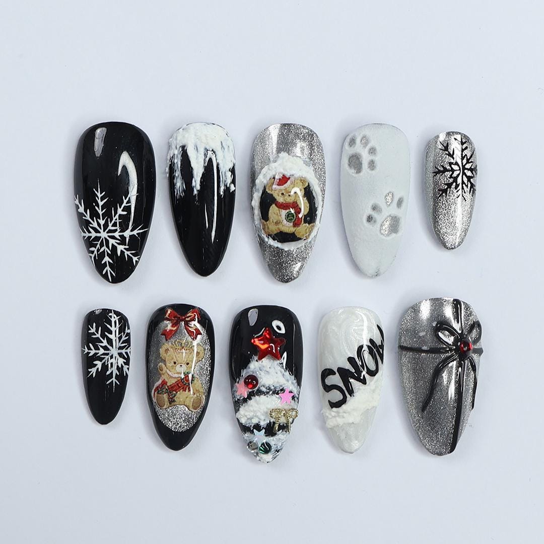 Elevate Your Holiday Style with Medium Almond Press-On Nails: Sleek Black Design Adorned with White Snowflakes - Perfect Christmas Gift