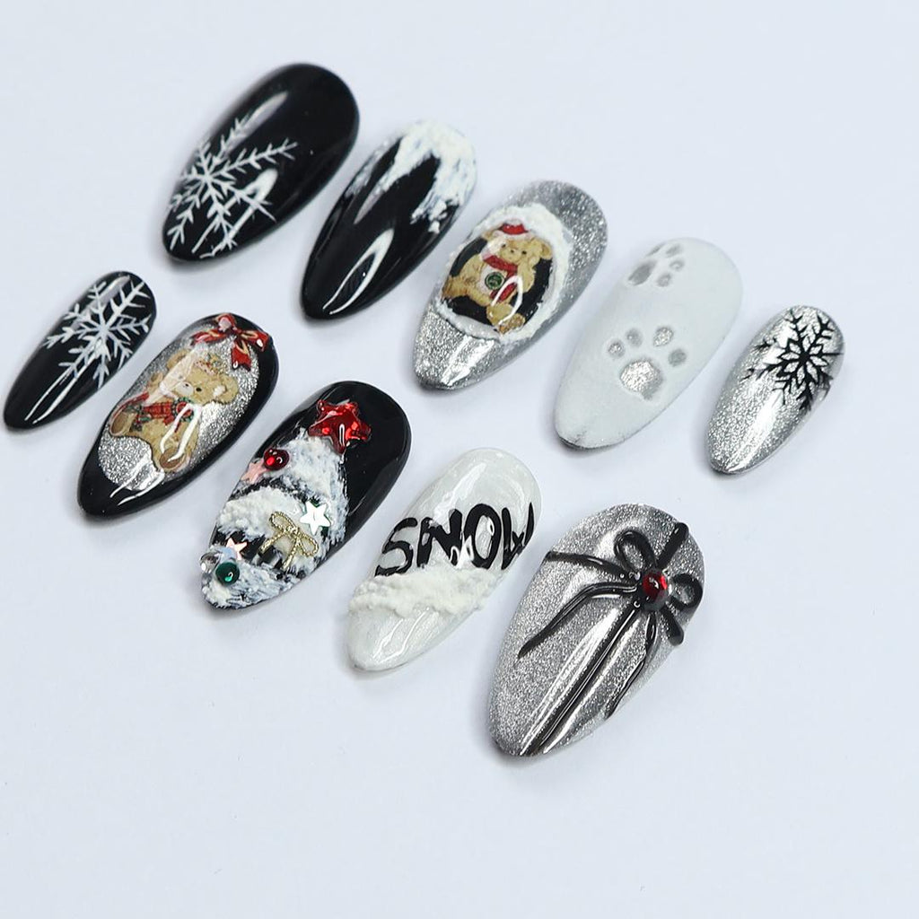 Elevate Your Holiday Style with Medium Almond Press-On Nails: Sleek Black Design Adorned with White Snowflakes - Perfect Christmas Gift