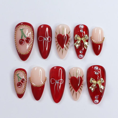Chic Dark Red Press-On Nails: Adorned with Gold Bows, Charming Cherries & Sparkling Gems - Perfect Holiday Glam or Thoughtful Gift for Her
