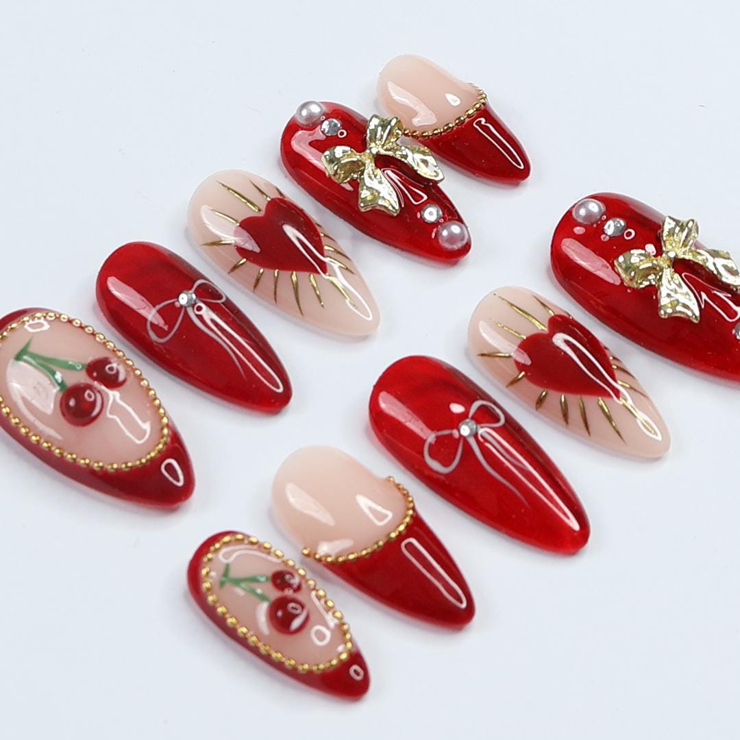 Chic Dark Red Press-On Nails: Adorned with Gold Bows, Charming Cherries & Sparkling Gems - Perfect Holiday Glam or Thoughtful Gift for Her