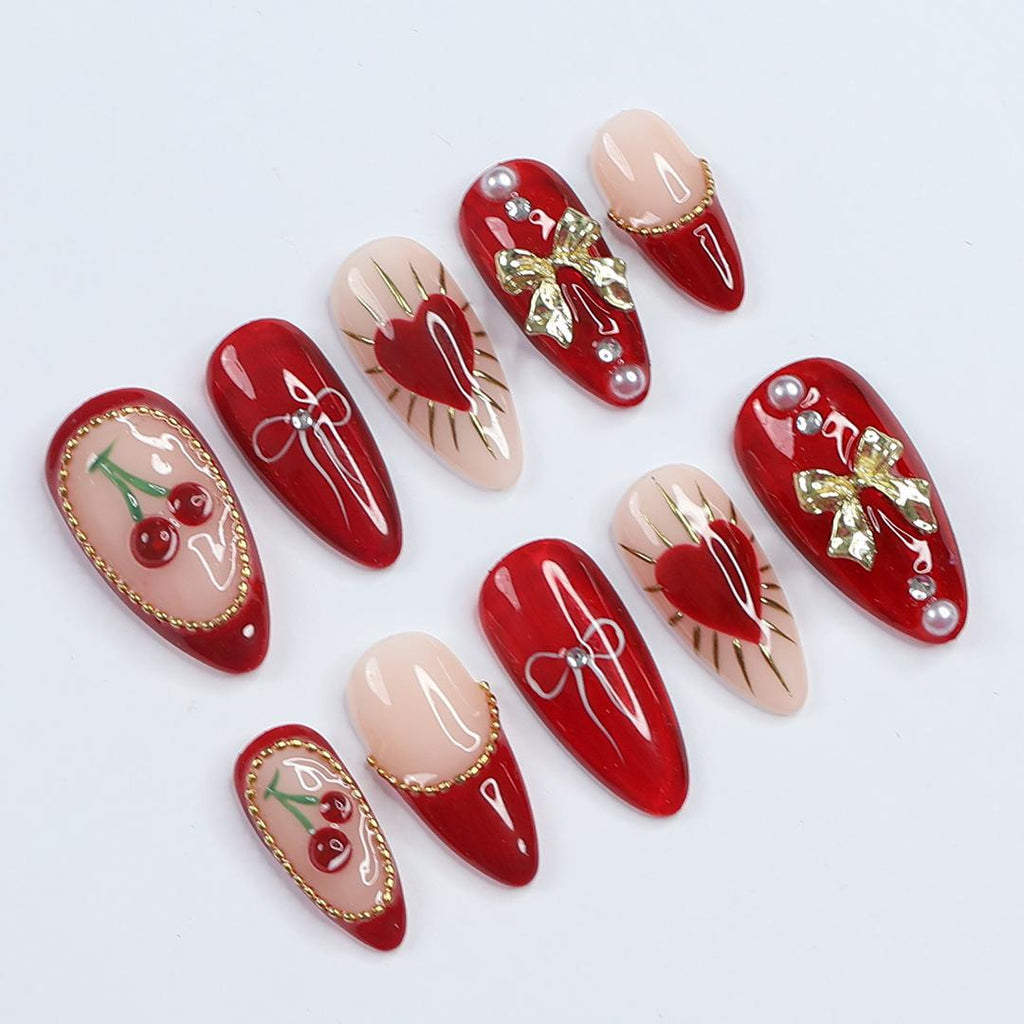 Chic Dark Red Press-On Nails: Adorned with Gold Bows, Charming Cherries & Sparkling Gems - Perfect Holiday Glam or Thoughtful Gift for Her