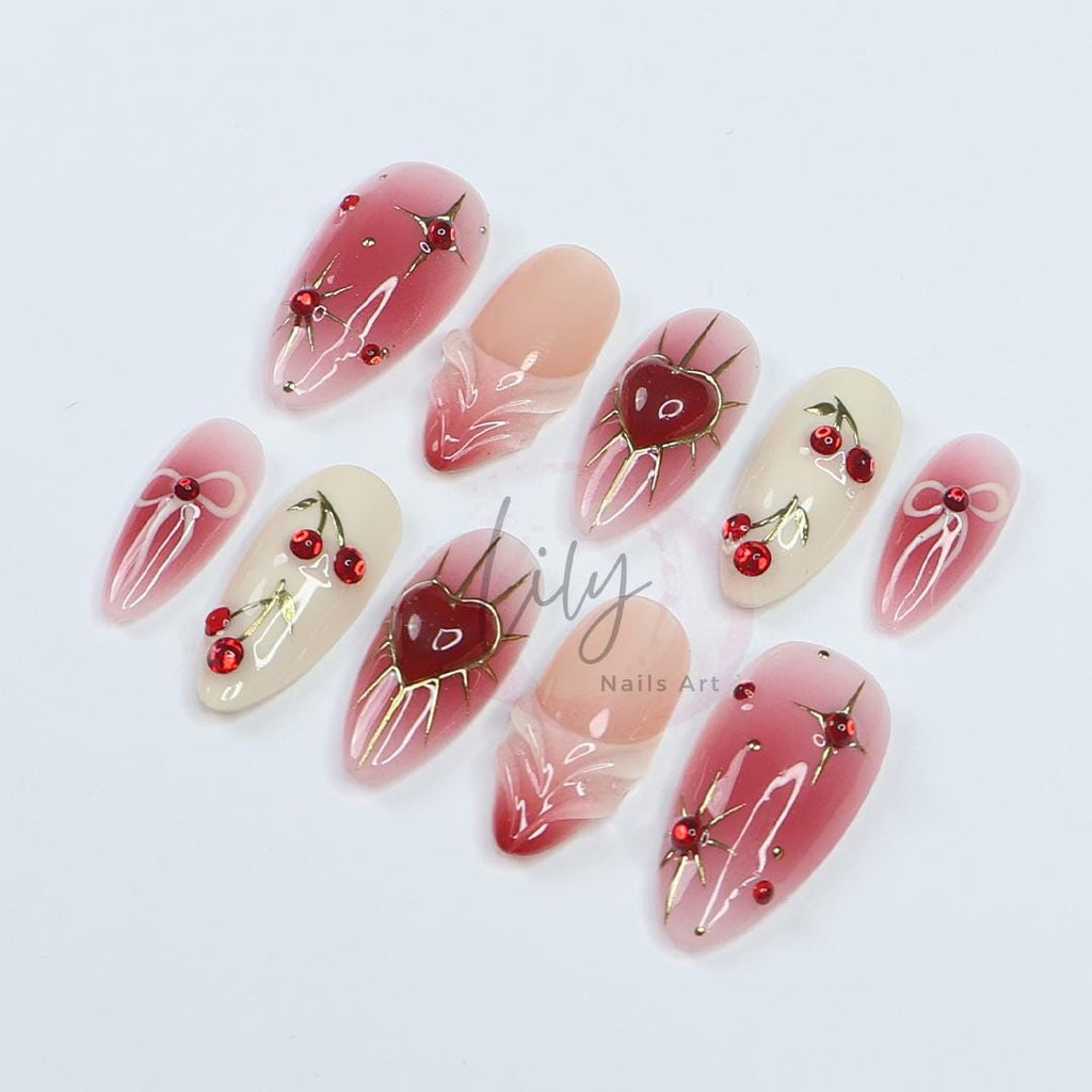 Elevate your nail with Red Aura Press-On Nails, featuring 3D gel hearts and cherries in medium almond, perfect for gifting or everyday glam
