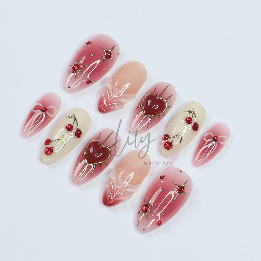 Elevate your nail with Red Aura Press-On Nails, featuring 3D gel hearts and cherries in medium almond, perfect for gifting or everyday glam