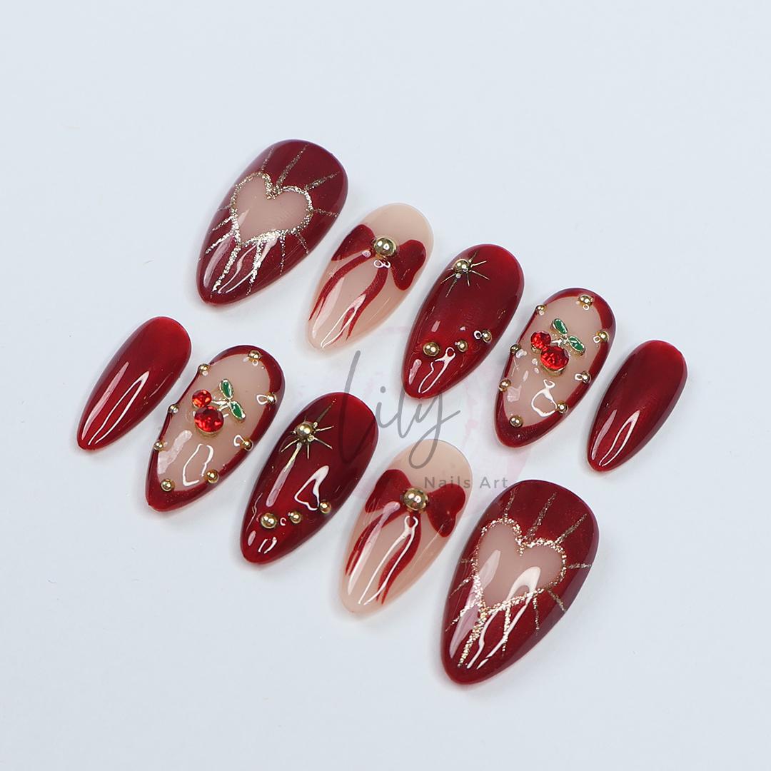 Valentine Vibes: Cherished Cherry Nail Art, Medium press-on nails adorned with bows & gold glitter - the perfect gift for her