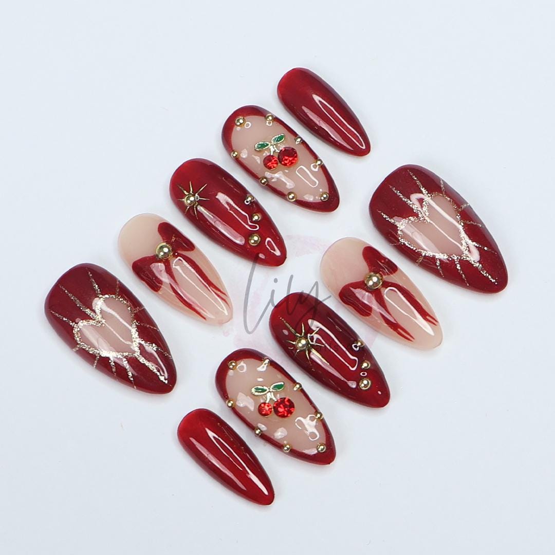 Valentine Vibes: Cherished Cherry Nail Art, Medium press-on nails adorned with bows & gold glitter - the perfect gift for her