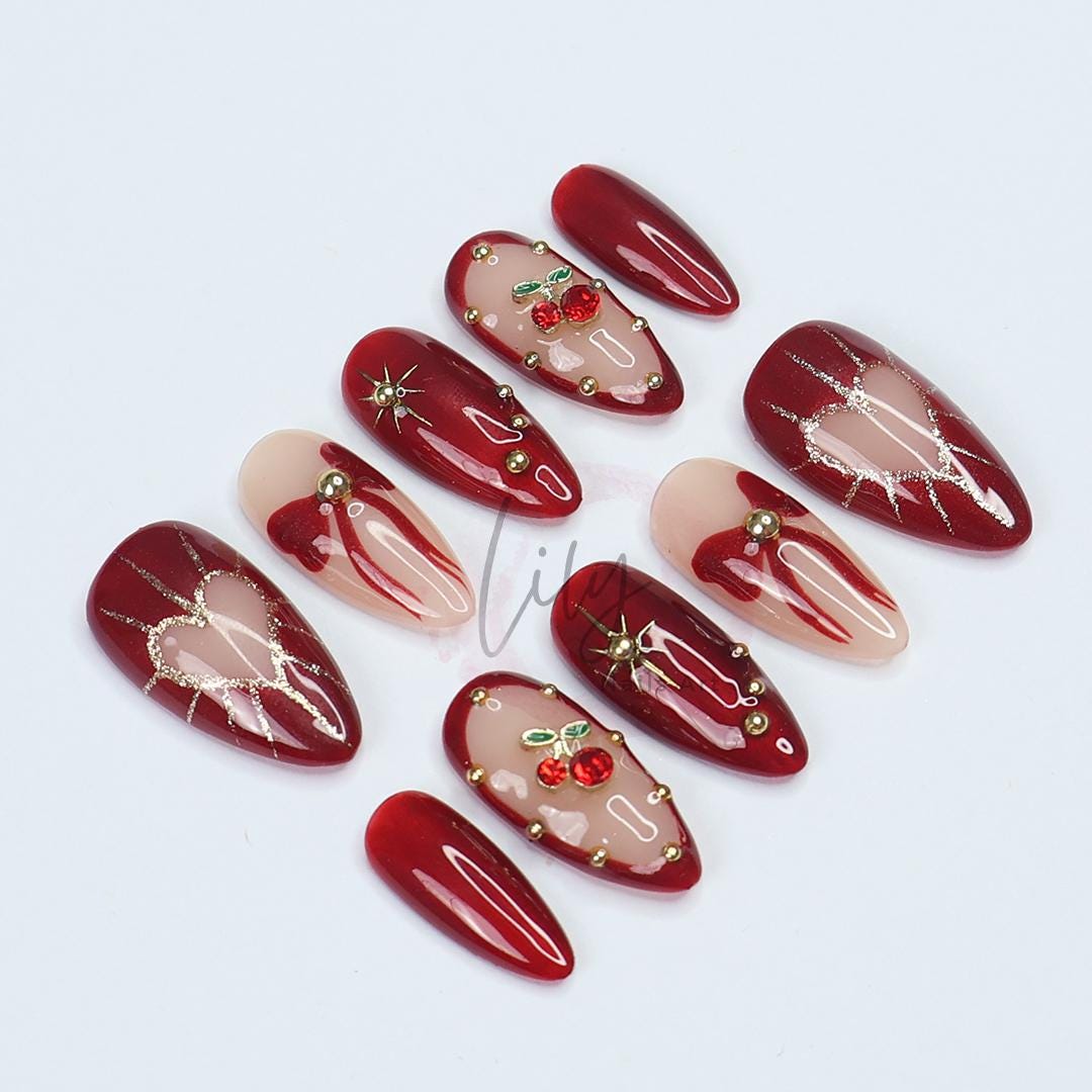 Valentine Vibes: Cherished Cherry Nail Art, Medium press-on nails adorned with bows & gold glitter - the perfect gift for her