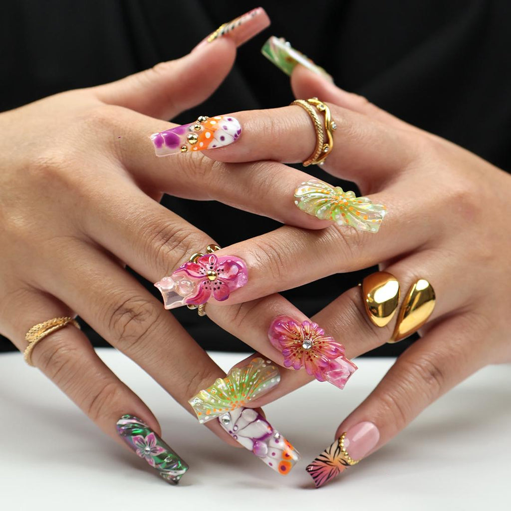 Vibrant spring press-on nails with 3D flowers, butterfly wings & animal print, perfect for birthdays, vacations or a unique gift for her