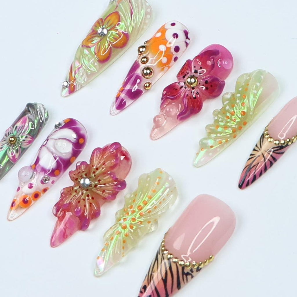Vibrant spring press-on nails with 3D flowers, butterfly wings & animal print, perfect for birthdays, vacations or a unique gift for her