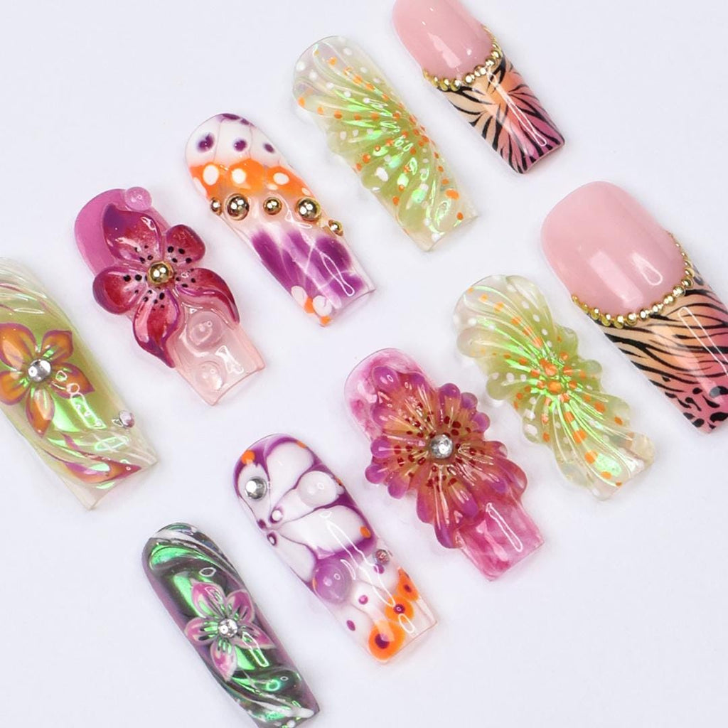 Vibrant spring press-on nails with 3D flowers, butterfly wings & animal print, perfect for birthdays, vacations or a unique gift for her