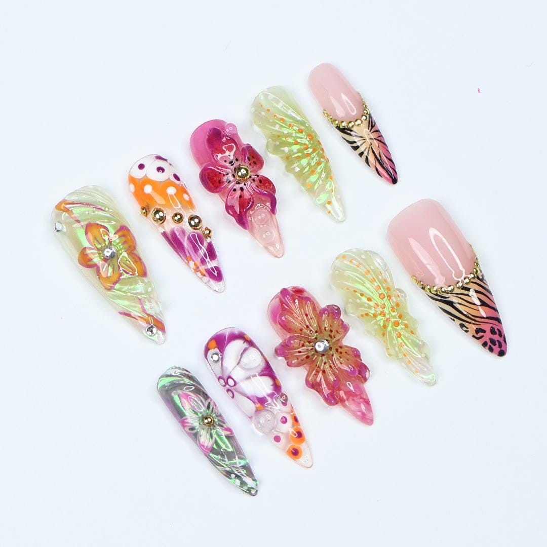 Vibrant spring press-on nails with 3D flowers, butterfly wings & animal print, perfect for birthdays, vacations or a unique gift for her