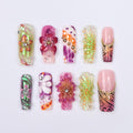 Vibrant spring press-on nails with 3D flowers, butterfly wings & animal print, perfect for birthdays, vacations or a unique gift for her