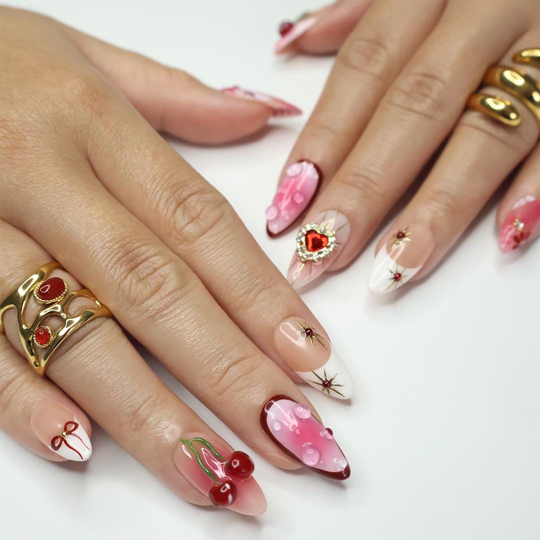 Press On Nails Golden Cupid with Cherry Charms | 3D Heart & Jewel Nails in Medium Almond | Handmade Romantic Nail Art for Holiday, Birthday