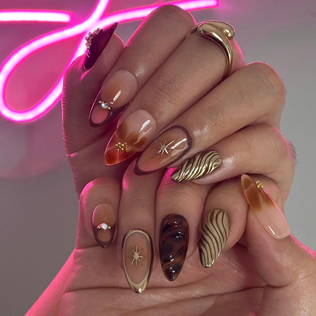 Fall Press On Nails with Tortoise Shell and Gold 3D Accents, Medium Almond Brown and Nude Nails with Starburst and Textured Chrome Design