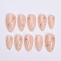 Minimal Press on Nail Gold Starburst with Nude Base | Everyday Fake Nail Art in Short Almond | Handmade Nail Art for Holiday, Birthday, Trip