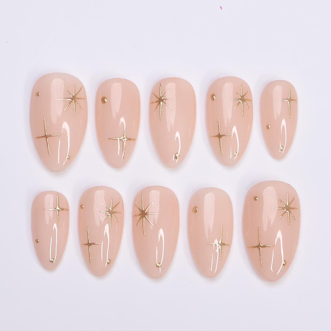 Minimal Press on Nail Gold Starburst with Nude Base | Everyday Fake Nail Art in Short Almond | Handmade Nail Art for Holiday, Birthday, Trip