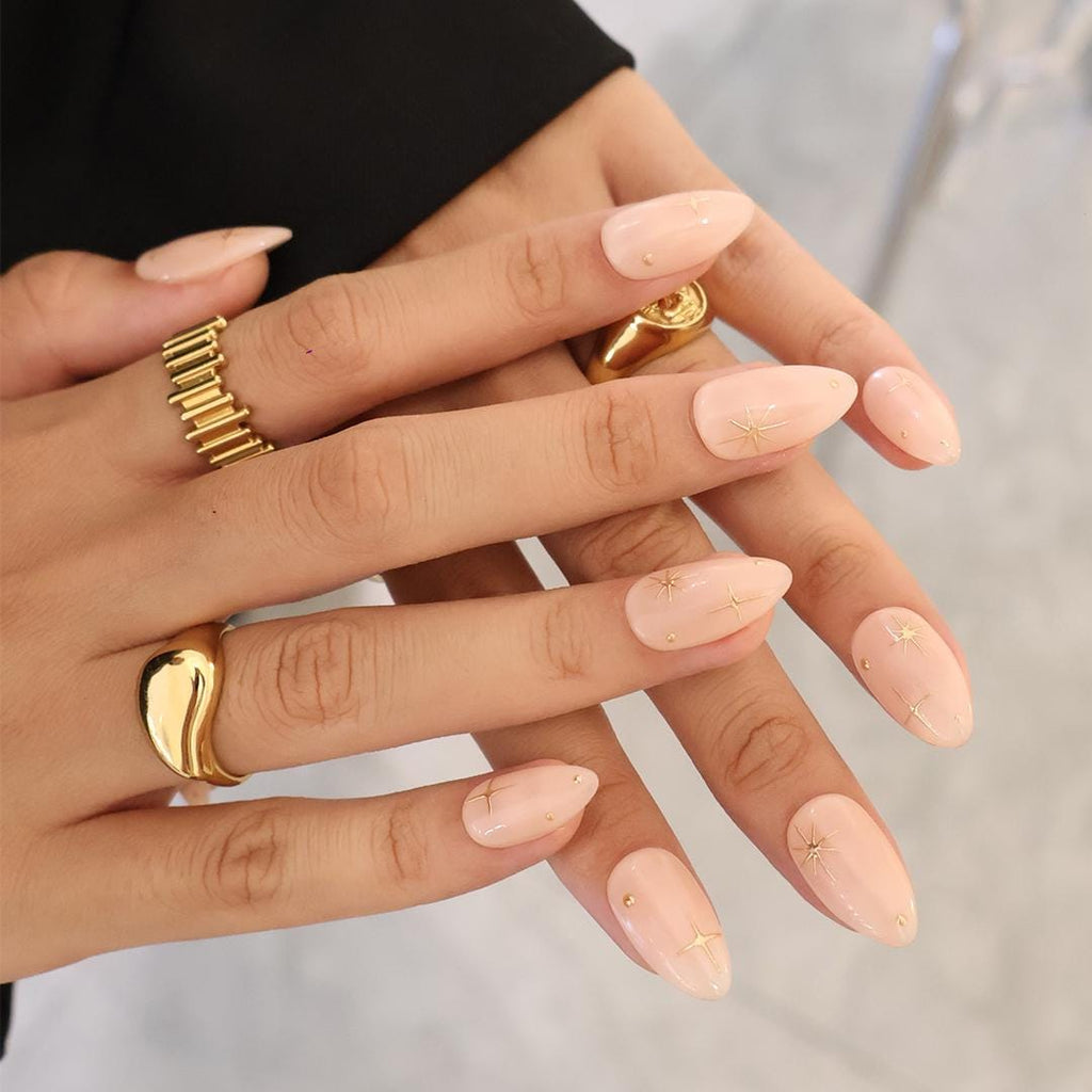 Minimal Press on Nail Gold Starburst with Nude Base | Everyday Fake Nail Art in Short Almond | Handmade Nail Art for Holiday, Birthday, Trip