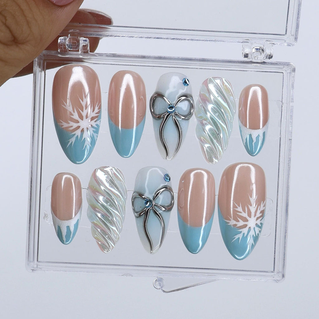 Winter Press On Nails with Snowflake & Silver Bow Design | Fake Nails in Medium Almond | Handmade Nail Art for Christmas Or Holiday Season