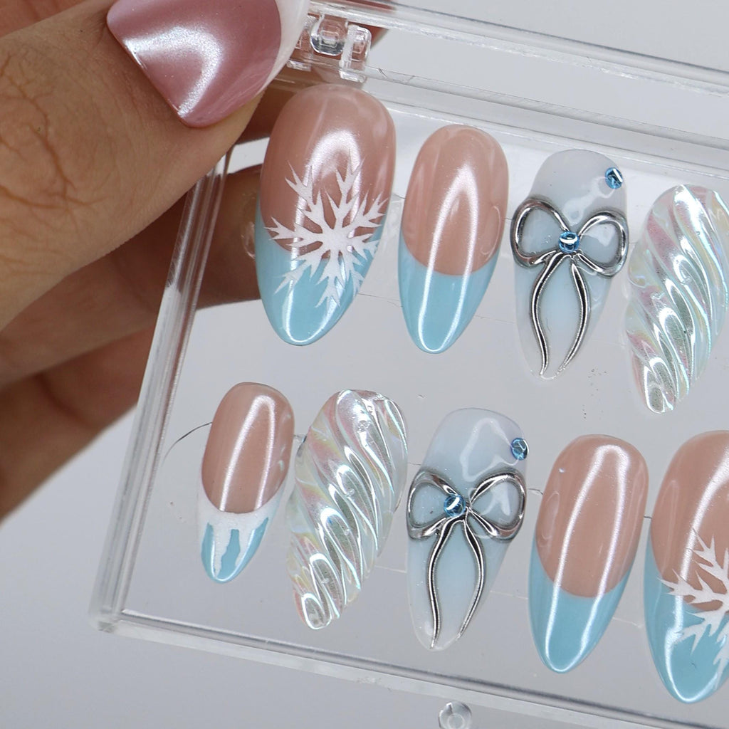 Winter Press On Nails with Snowflake & Silver Bow Design | Fake Nails in Medium Almond | Handmade Nail Art for Christmas Or Holiday Season