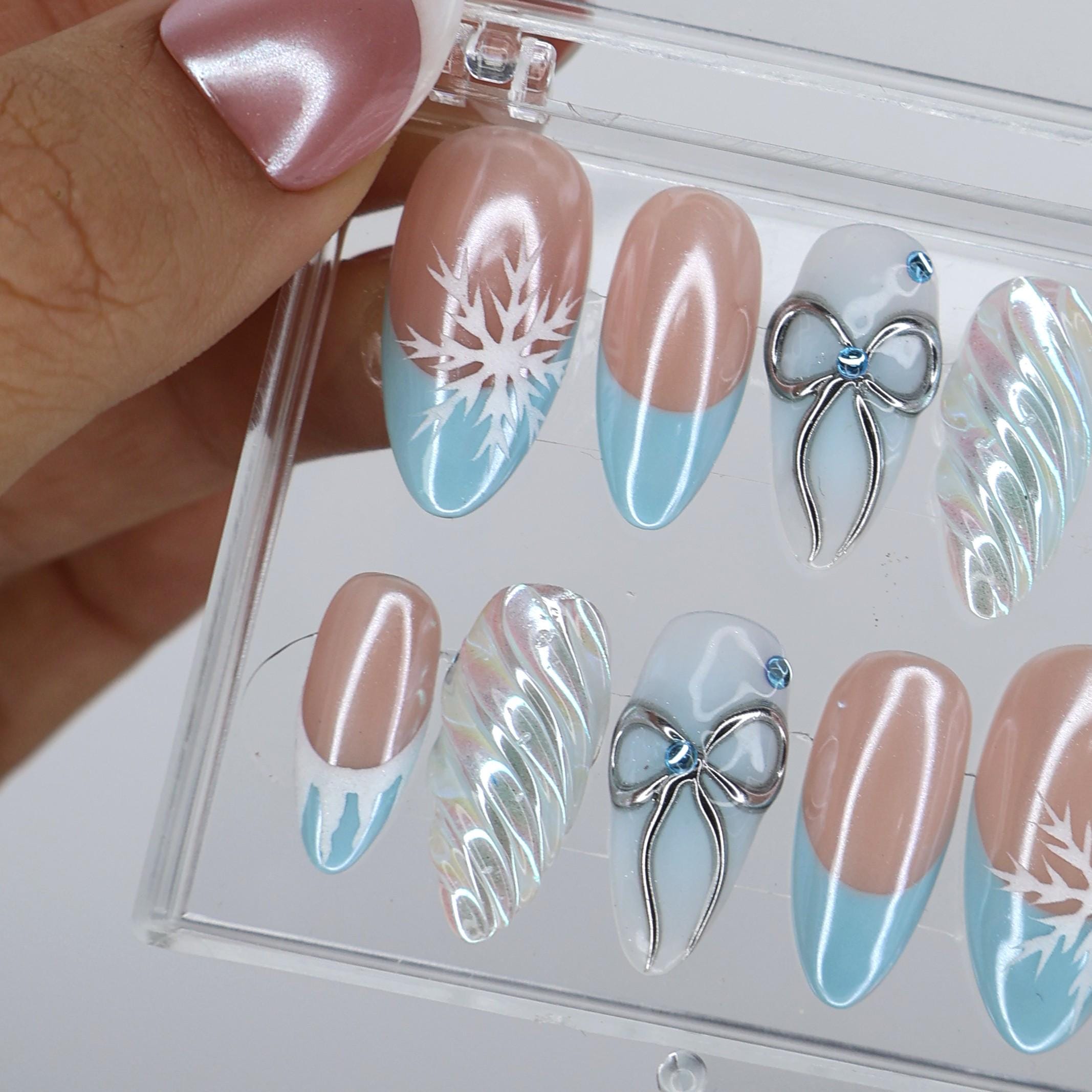 Winter Press On Nails with Snowflake & Silver Bow Design | Fake Nails in Medium Almond | Handmade Nail Art for Christmas Or Holiday Season