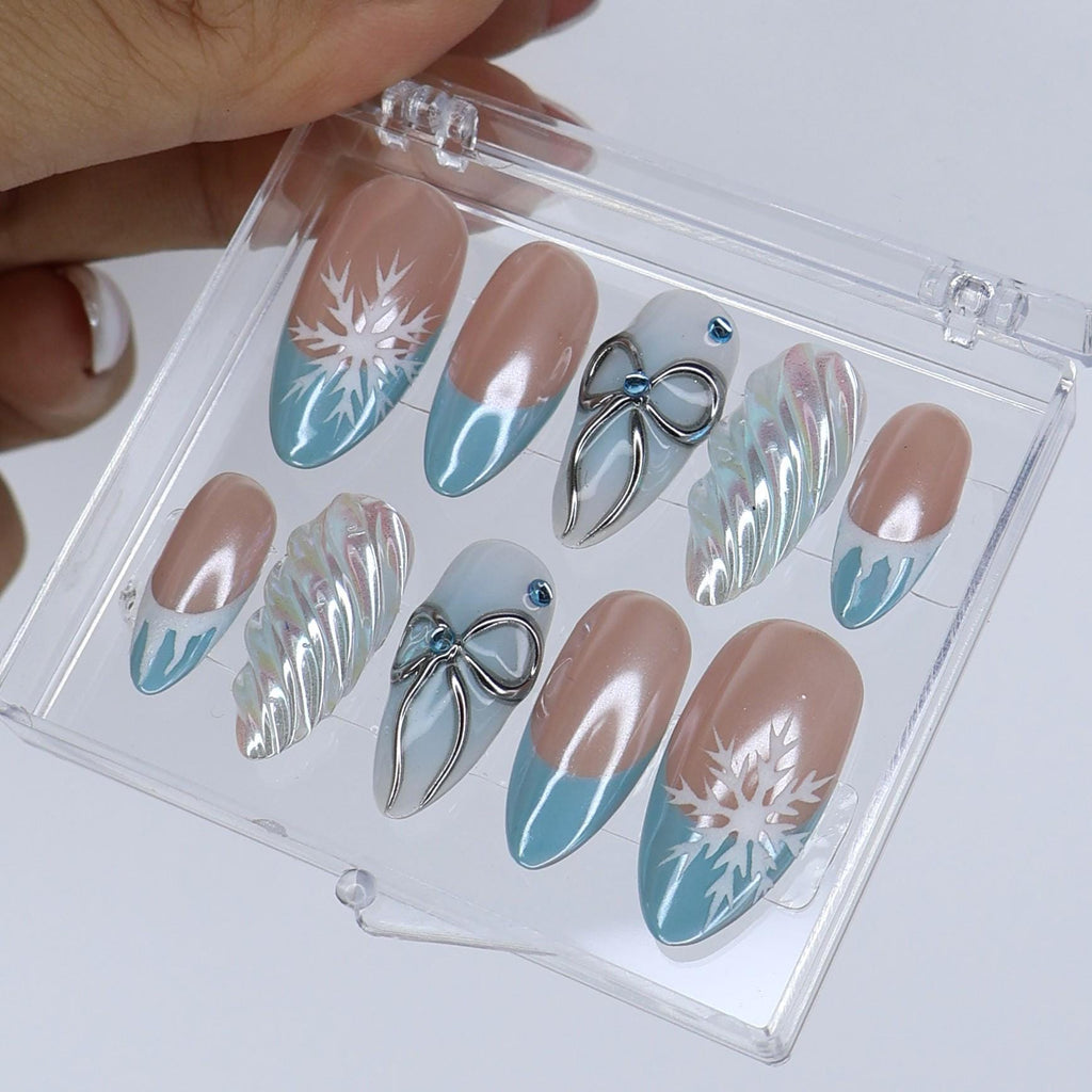 Winter Press On Nails with Snowflake & Silver Bow Design | Fake Nails in Medium Almond | Handmade Nail Art for Christmas Or Holiday Season