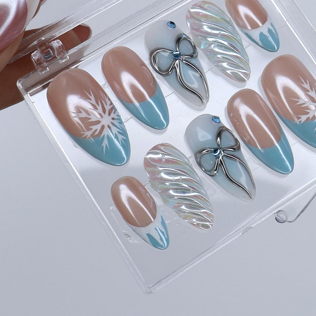 Winter Press On Nails with Snowflake & Silver Bow Design | Fake Nails in Medium Almond | Handmade Nail Art for Christmas Or Holiday Season