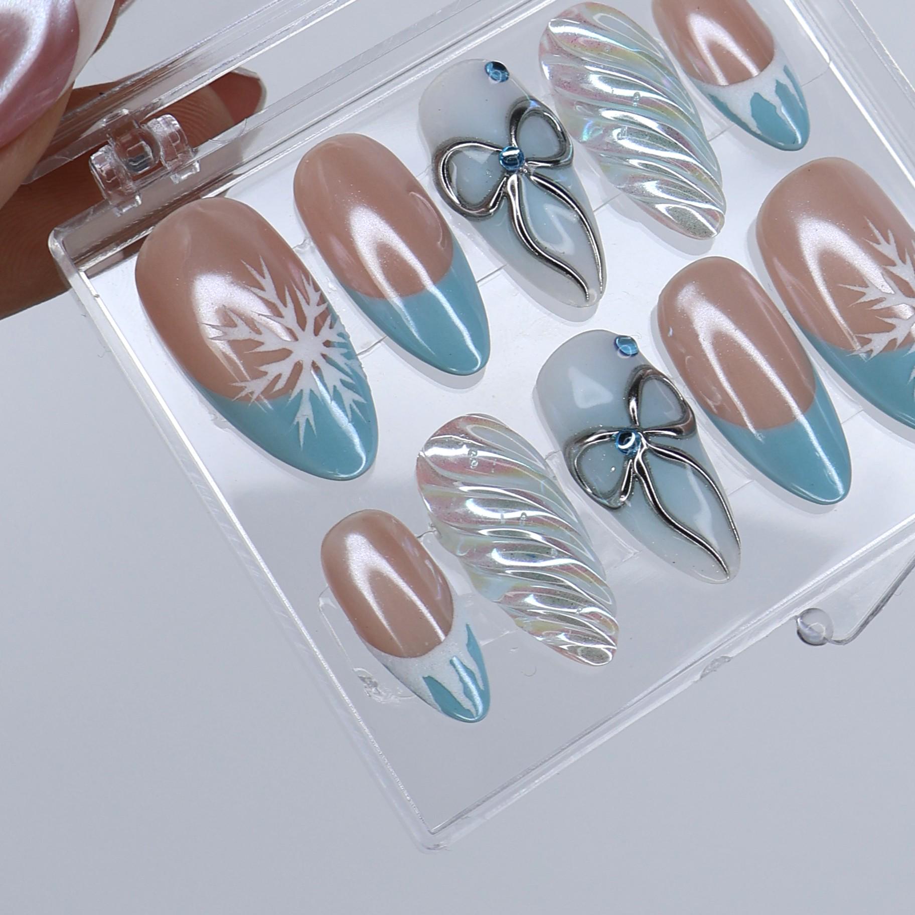 Winter Press On Nails with Snowflake & Silver Bow Design | Fake Nails in Medium Almond | Handmade Nail Art for Christmas Or Holiday Season