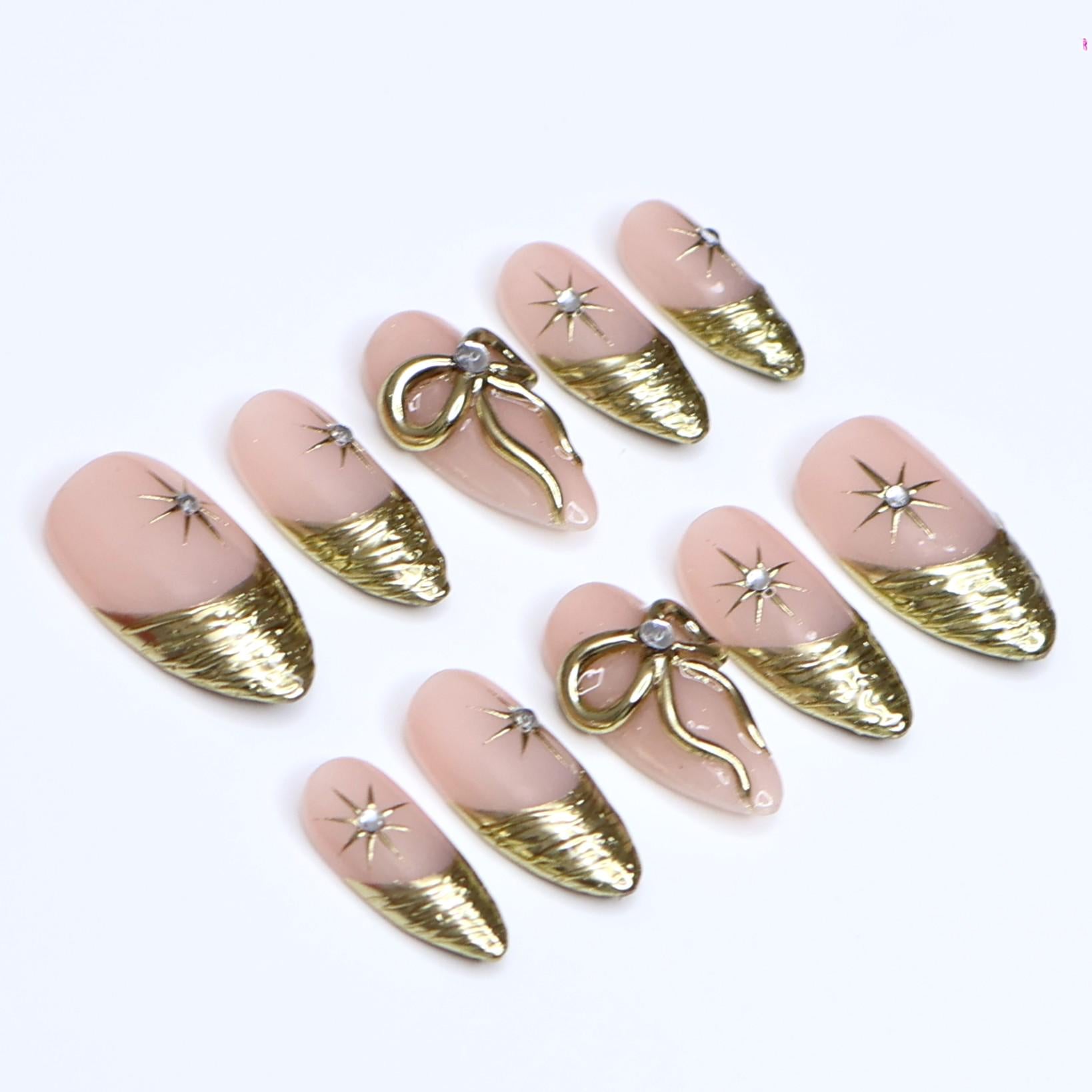 Gold Press On Nails | Nude Base with Gold Bow & Star Design | Medium Almond Fake Nails | Handmade Nail Art for Everyday Wear