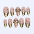 Gold Press On Nails | Nude Base with Gold Bow & Star Design | Medium Almond Fake Nails | Handmade Nail Art for Everyday Wear