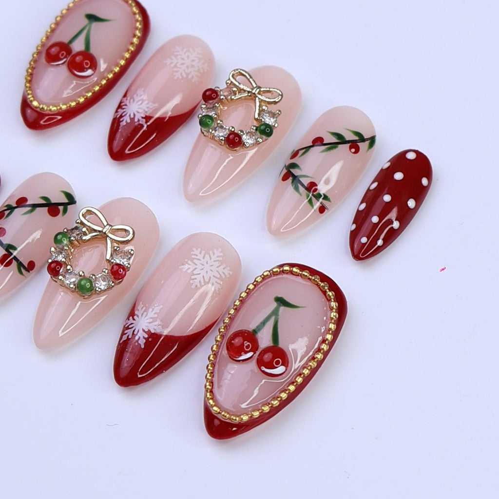 Christmas Press On Nails with Cherries, Snowflakes & Wreath Charms | Fake Nails in Medium Almond | Handmade Holiday Nail Art Gift Set